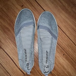Grey and white flat slip on